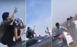 فتاة مخمورة ترقص فوق سيارة